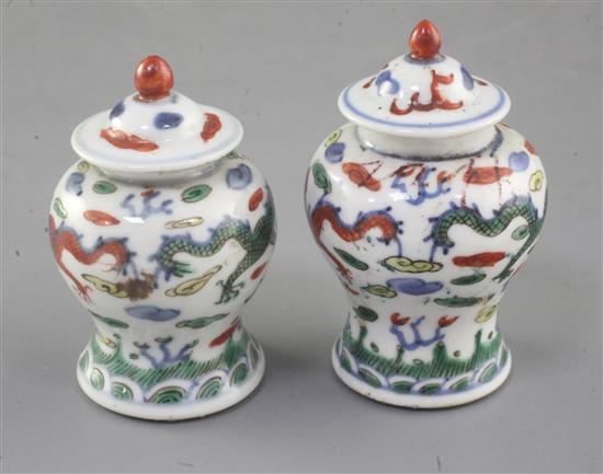 A near pair of Chinese miniature wucai baluster jars and covers, late 19th/early 20th century, 7.5cm